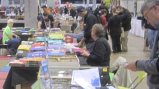 vrecheckDisplay cases, bargain boxes, and binders with priced cards in various grades are all part of what dealers bring to shows.
