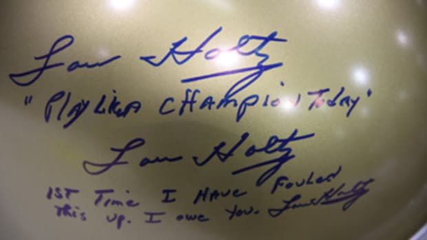 Not all signatures and inscriptions are pulled off without a hitch. Lou Holtz made up for his snafu. 
