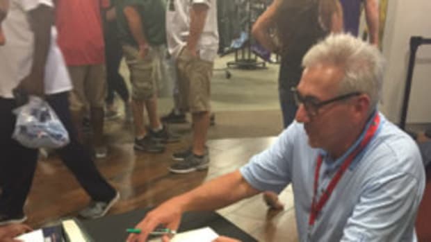  ESPN’s Sal Paolantonio signs copies of his book at the Pro Football Hall of Fame. (Barry Blair photo)