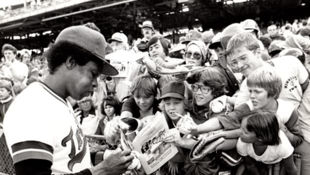 Rod Carew of the Minnesota Twins signs autographs at Yankee Stadium in a vintage 1978 shot.