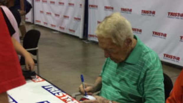  Marv Levy, who guided the Buffalo Bills to four straight Super Bowls, signs a mini-helmet for a fan. (Greg Bates photos)