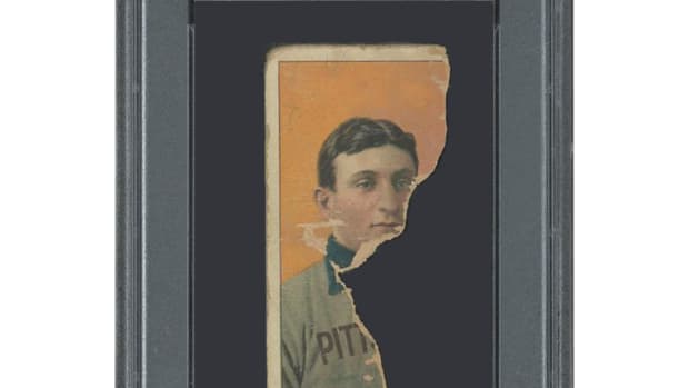 A T206 Honus Wagner card that is torn almost in half is up for auction at SCP Auctions.