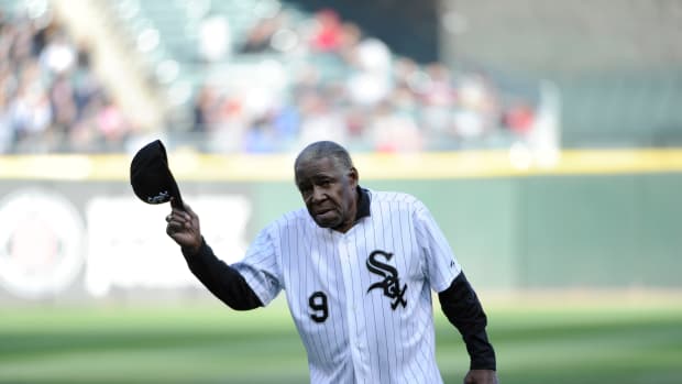 Former Chicago White Sox star Minnie Minoso throws out the first pitch on April 26, 2014 at U.S. Cellular Field in Chicago.
