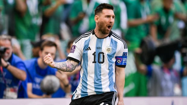 Lionel Messi celebrates after scoring his first goal during Group C of the 2022 FIFA World Cup in Qatar.