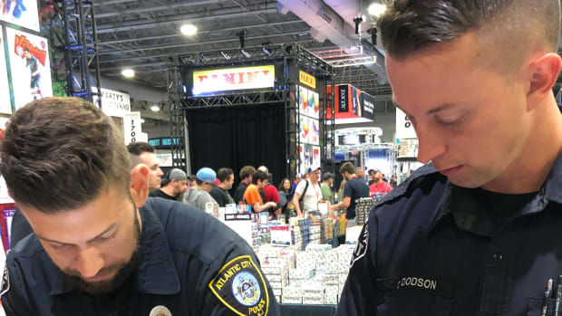 Detectives from the Atlantic City Police Department investigate the alleged theft of sports cards at the National Sports Collectors Convention.