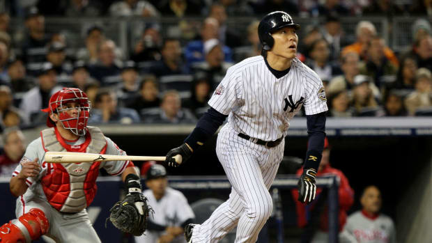 Hideki Matsui belts a home run at Yankee Stadium on Oct. 29, 2009.