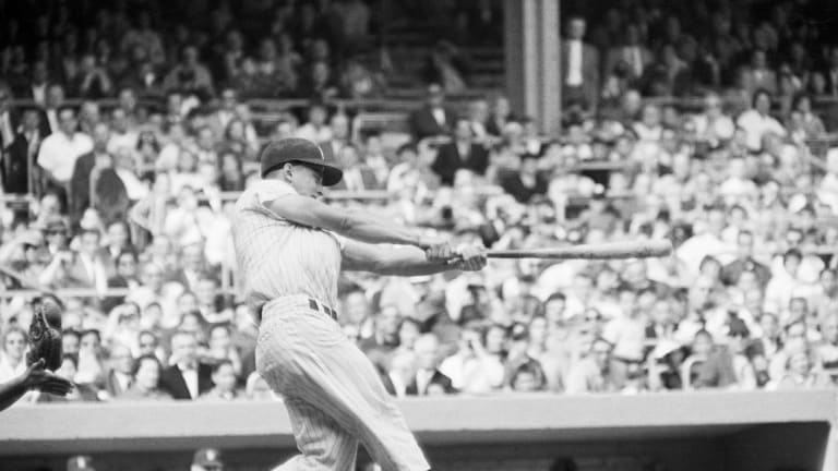 Roger Maris (right) and Tony Kubek hit Yankee home runs on August