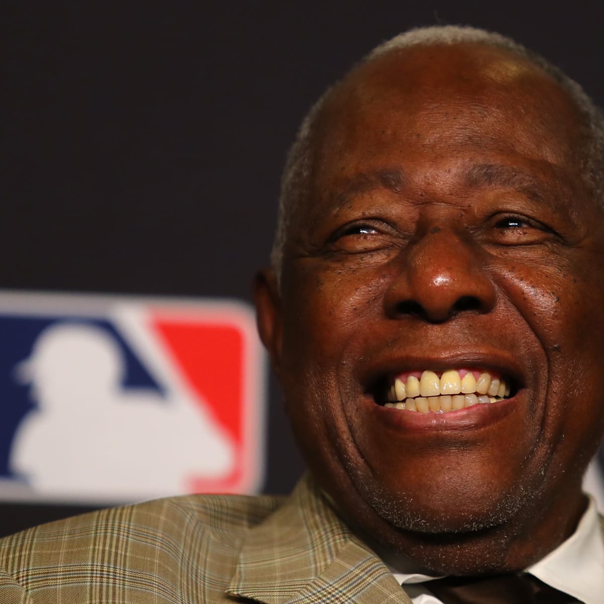 Outfielder Hank Aaron of the Atlanta Braves swings and watches the News  Photo - Getty Images