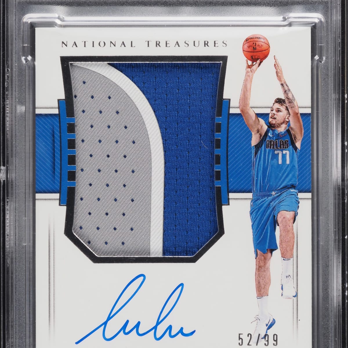 A Luka Doncic' rookie card with a patch of one of his game-worn