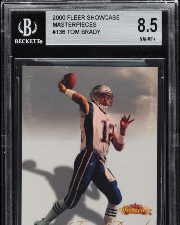 2000 Fleer Showcase Masterpieces Tom Brady 1/1 rookie card that has a duplicate.