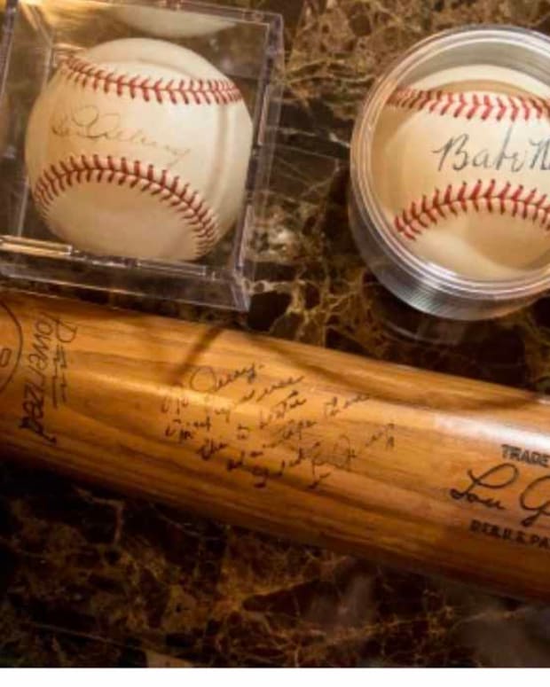 A Lou Gehrig bat and baseball signed by Gehrig and Babe Ruth.