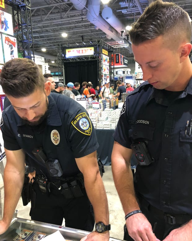 Detectives from the Atlantic City Police Department investigate the alleged theft of sports cards at the National Sports Collectors Convention.