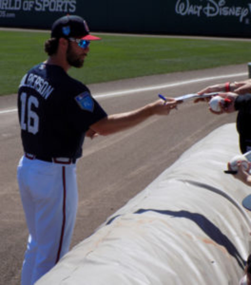  Atlanta Braves player Charlie Culberson signs autographs before a Spring Training game in Orlando, Florida.