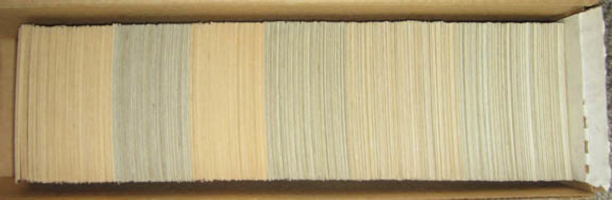 A 1960 Topps master set – the first printing on the left was on whiteback cardboard, the next printing was all gray, and then both white and gray were used. 