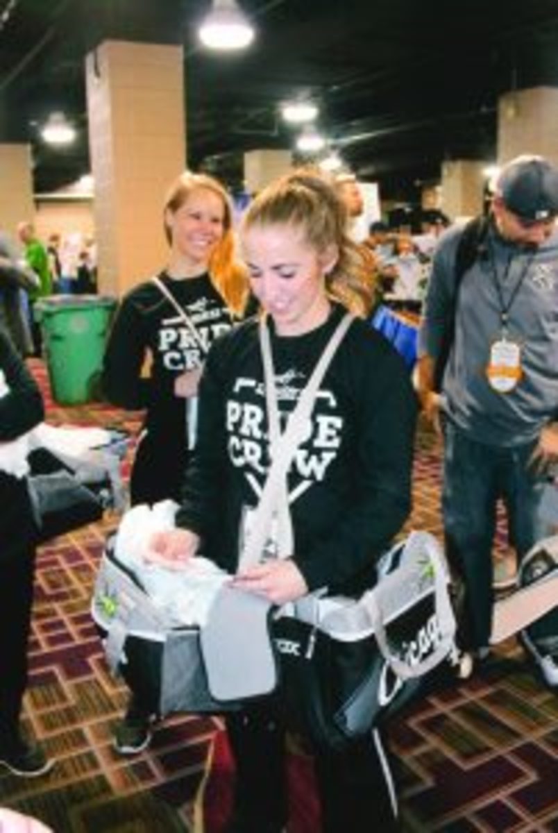 The White Sox Pride Crew strolling around Soxfest handing out hats and t-shirts to fans who correctly answered trivia questions. 