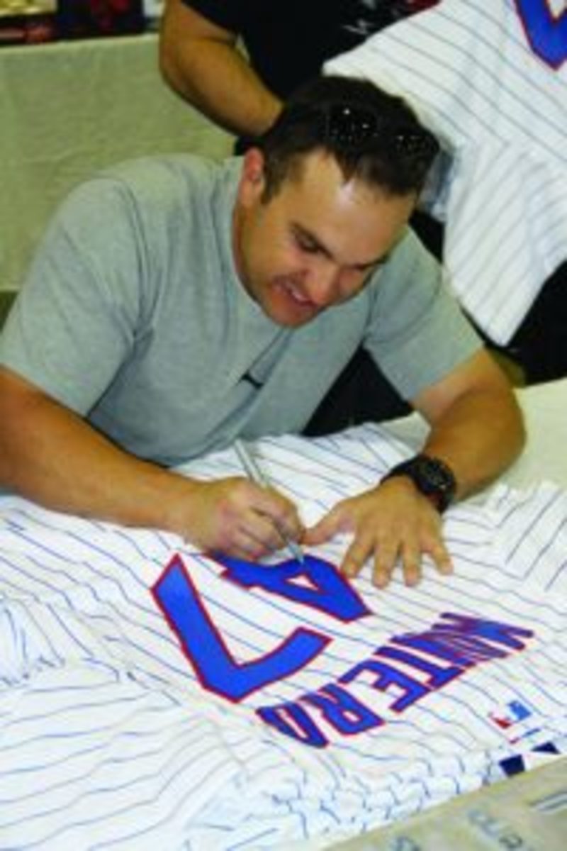 Chicago Cubs catcher Miguel Montero autographs a jersey at the annual Fanatics Authentic Sports Spectacular. Photos courtesy Ross Forman