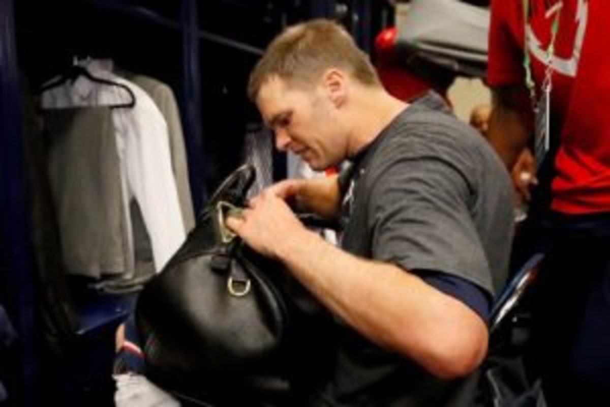 Tom Brady of the New England Patriots looks for his missing jersey in the locker room after defeating the Atlanta Falcons during Super Bowl 51. (Photo by Kevin C. Cox/Getty Images)