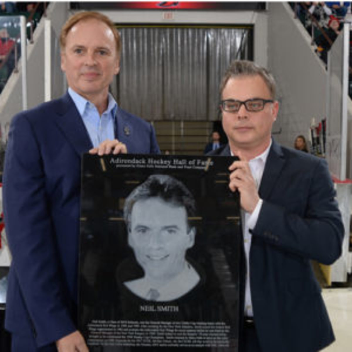  Neil Smith (left) with his Hall of Fame plaque with Adirondack Thunder General Manager Jeff Meade (right) at the induction ceremony when Smith was inducted into the Adirondack Hockey Hall of Fame. (Photos courtesy Adirondack Thunder organization)