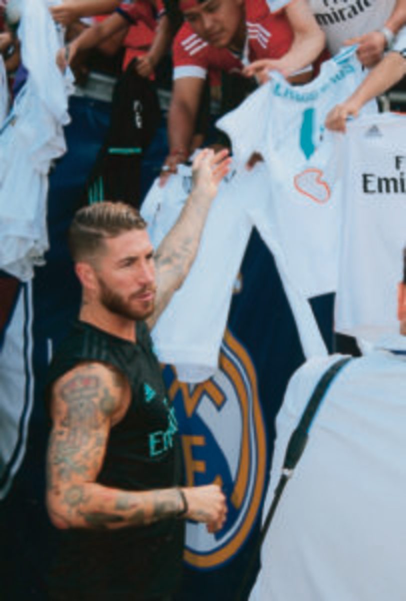  Real Madrid player Sergio Ramos signs autographs for fans.