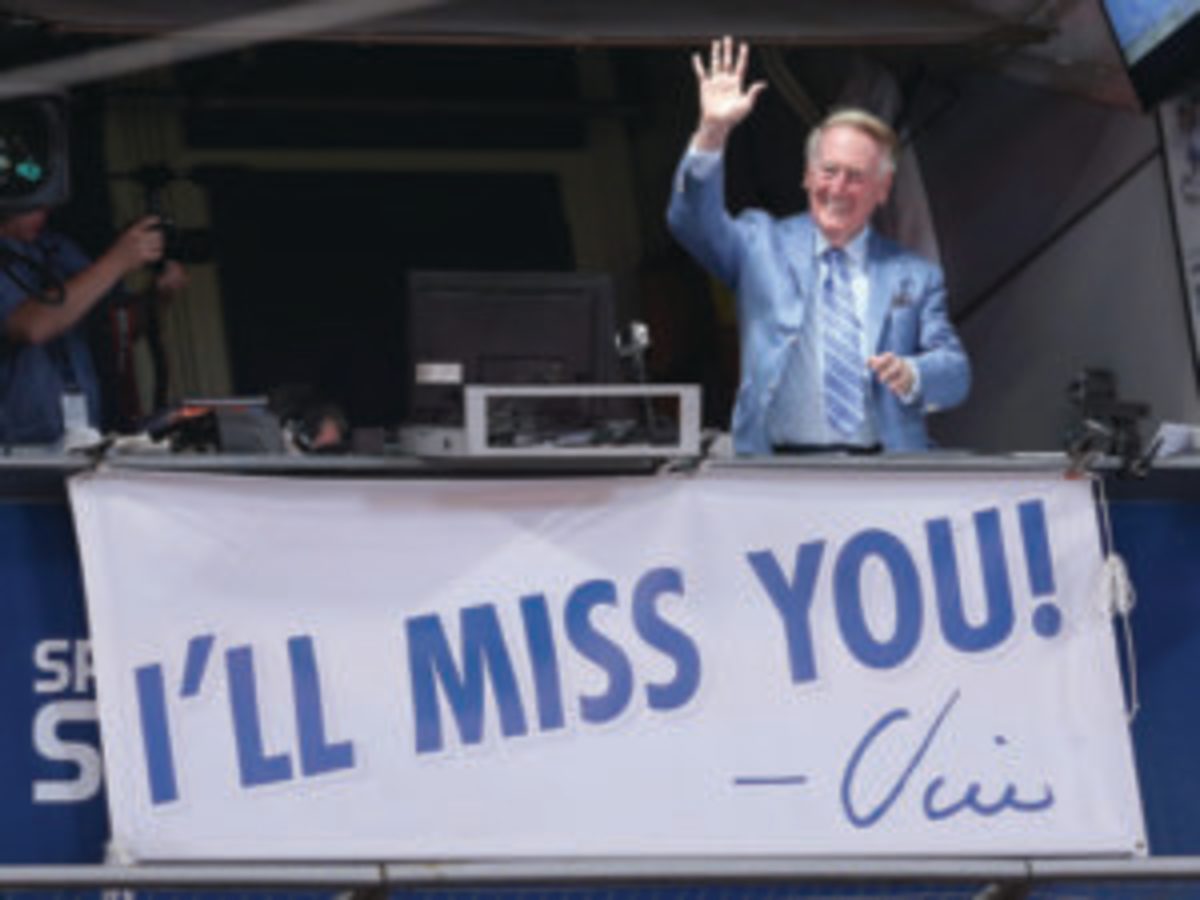  Los Angeles Dodgers broadcaster Vin Scully waves to the crowd after leading in the singing of Take Me Out to the Ball Game during the seventh inning stretch of the game with the Colorado Rockies at Dodger Stadium on September 24, 2016 in Los Angeles, California. The Dodgets won 14-1. (Photo by Stephen Dunn/Getty Images)