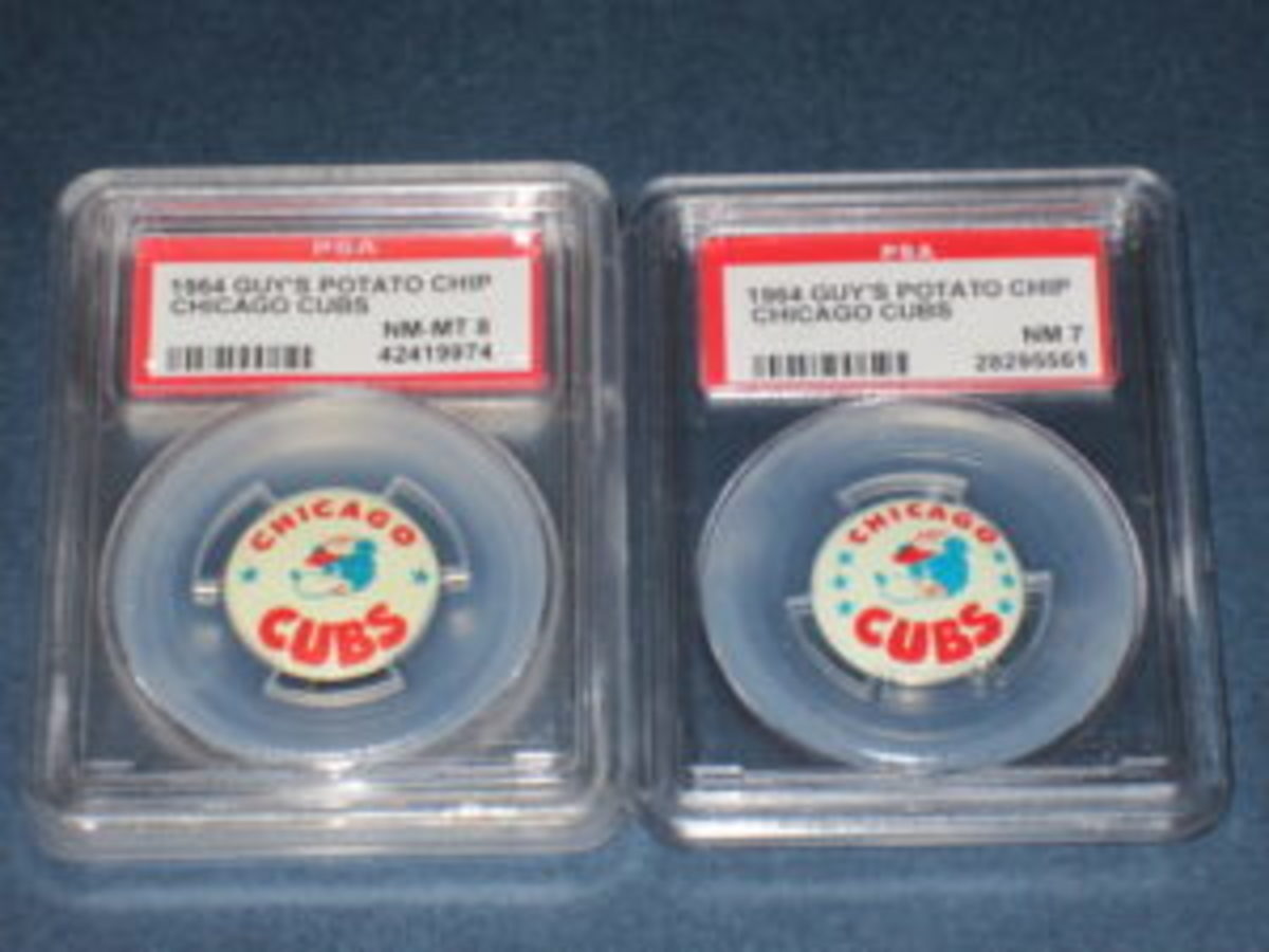  The front of the 1964 Chicago Cubs Guy’s Potato Chips metal baseball pins came in two versions. One version had only one star on each side of the pin (left), while the other version had three stars on each side of the front of the pin (right).