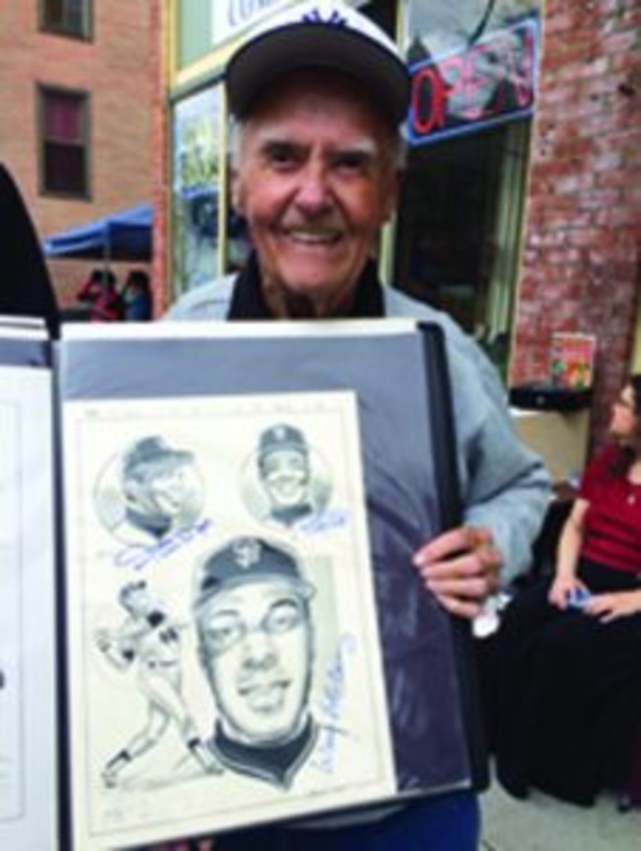 Joe Sinnott with one of his favorite drawings he drew featuring Willie Mays, Willie McCovey and Juan Marichal. The drawing is autographed by all three Hall of Famers. 