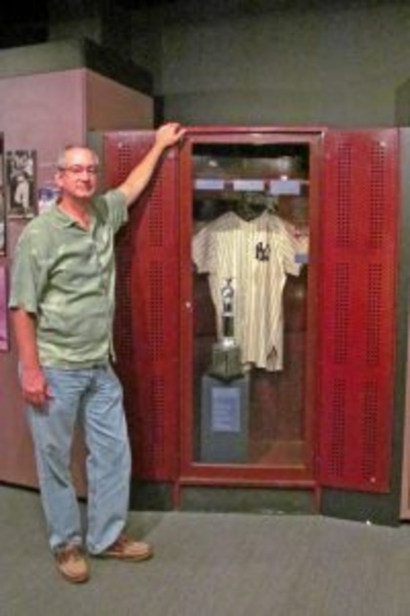 Sports hobby enthusiast Escue visited the Baseball Hall of Fame in 2013 and posed next to Lou Gehrig’s locker. Photo courtesy of J. Escue.