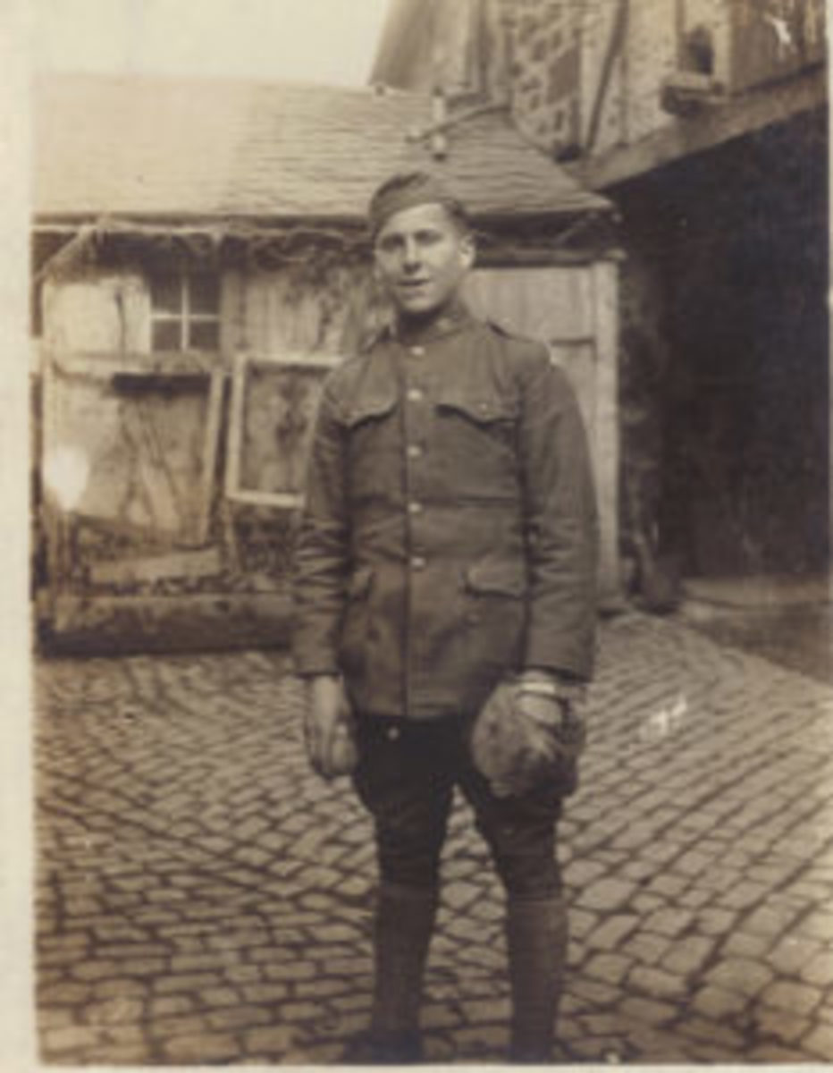  After the signing of the Armistice, a large number of Doughboys found themselves occupying the German Rhineland. In this photo, Albert Pittson, an engineer in the 3rd Division, poses with his baseball mitt and ball in the German town of Ochtendung in April 1919.