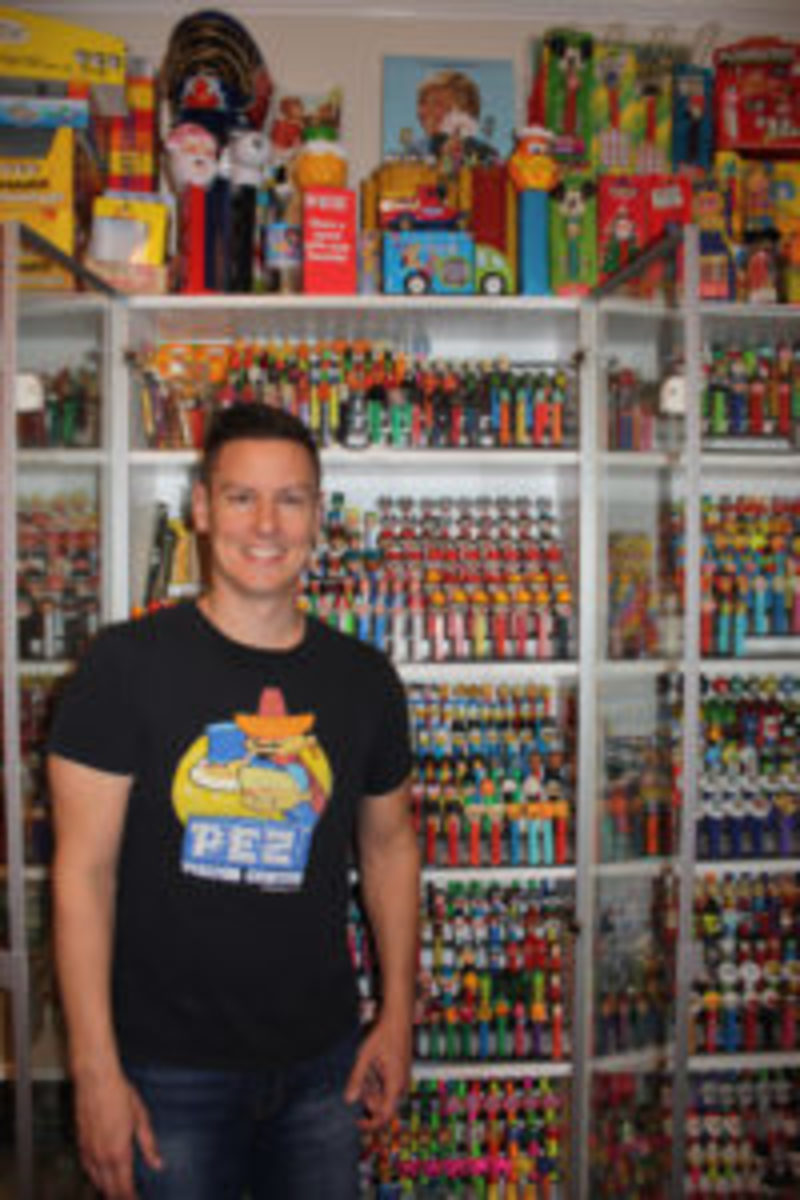  Brian Jaskolski stands in front of just a portion of his collection of Pez dispensers. (Photos courtesy Brian Jaskolski)
