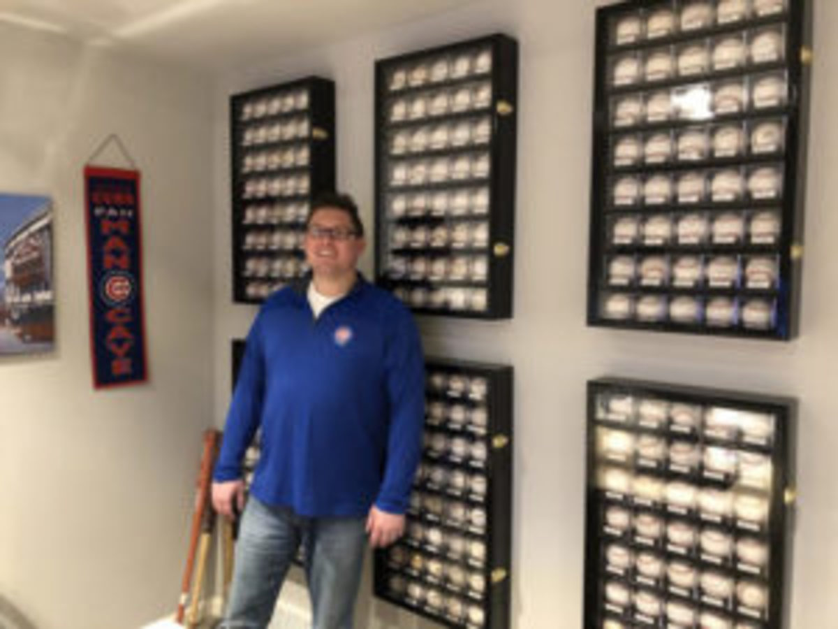  Beau Thompson amongst the many autographed baseballs he has added to his sports memorabilia collection through the years. (Photos courtesy Beau Thompson)