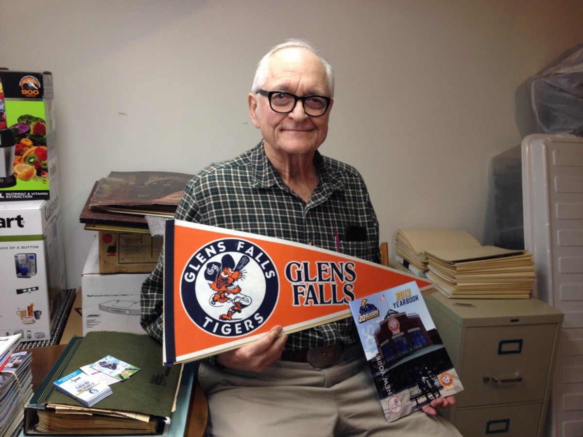 Frank Schafer, a former co-owner of the Glens Falls Tigers with Richard Stanley, displays a rare Tigers pennant. Schafer recalls crafting a team and a place to play in Glens Falls as close to a miracle.
