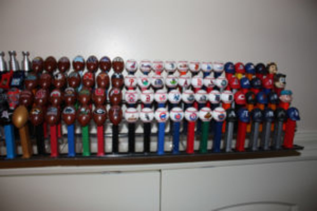  A sampling of the sports related Pez dispensers covering basketball, soccer, hockey, baseball and football.