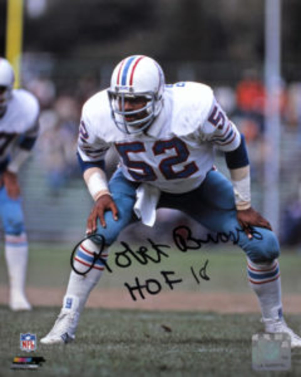  Since becoming a member of the Pro Football Hall of Fame this year Robert Brazile signs his autograph with the inscription “HOF 18.”