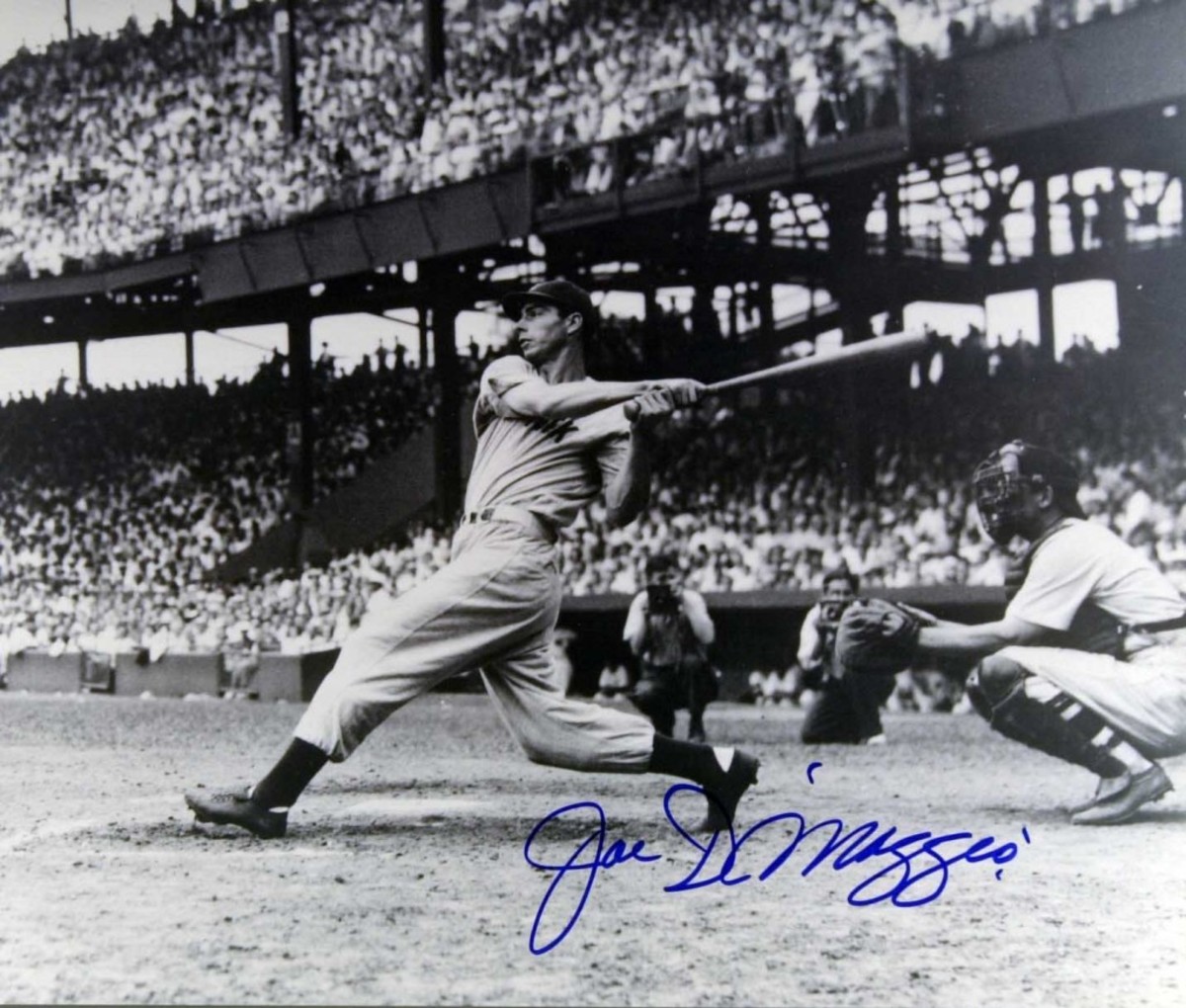 A classic shot of the great Joe DiMaggio in action. The only thing that’s wrong is the signature is a fake.