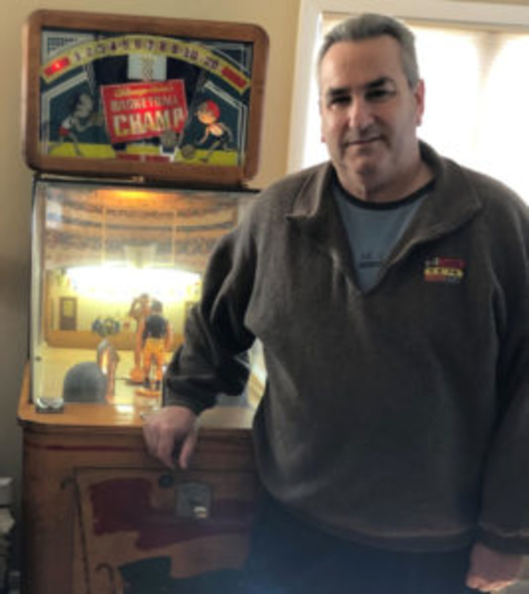  Rich Wolfin with one of his many vintage arcade machines, Basketball Champ, from 1947 by Chicago Coin.