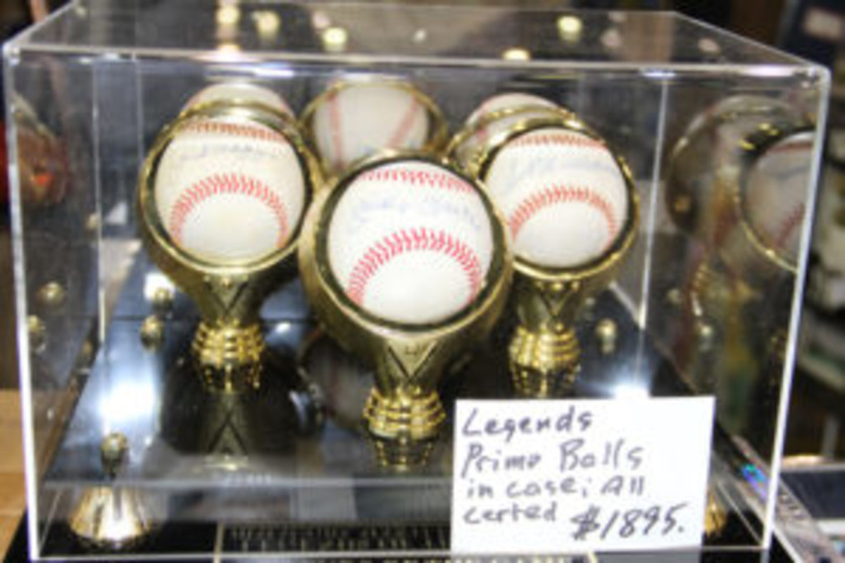  A tri-fecta of autographed baseballs including those signed by Joe DiMaggio, Mickey Mantle, and Ted Williams could be had for $1,895.