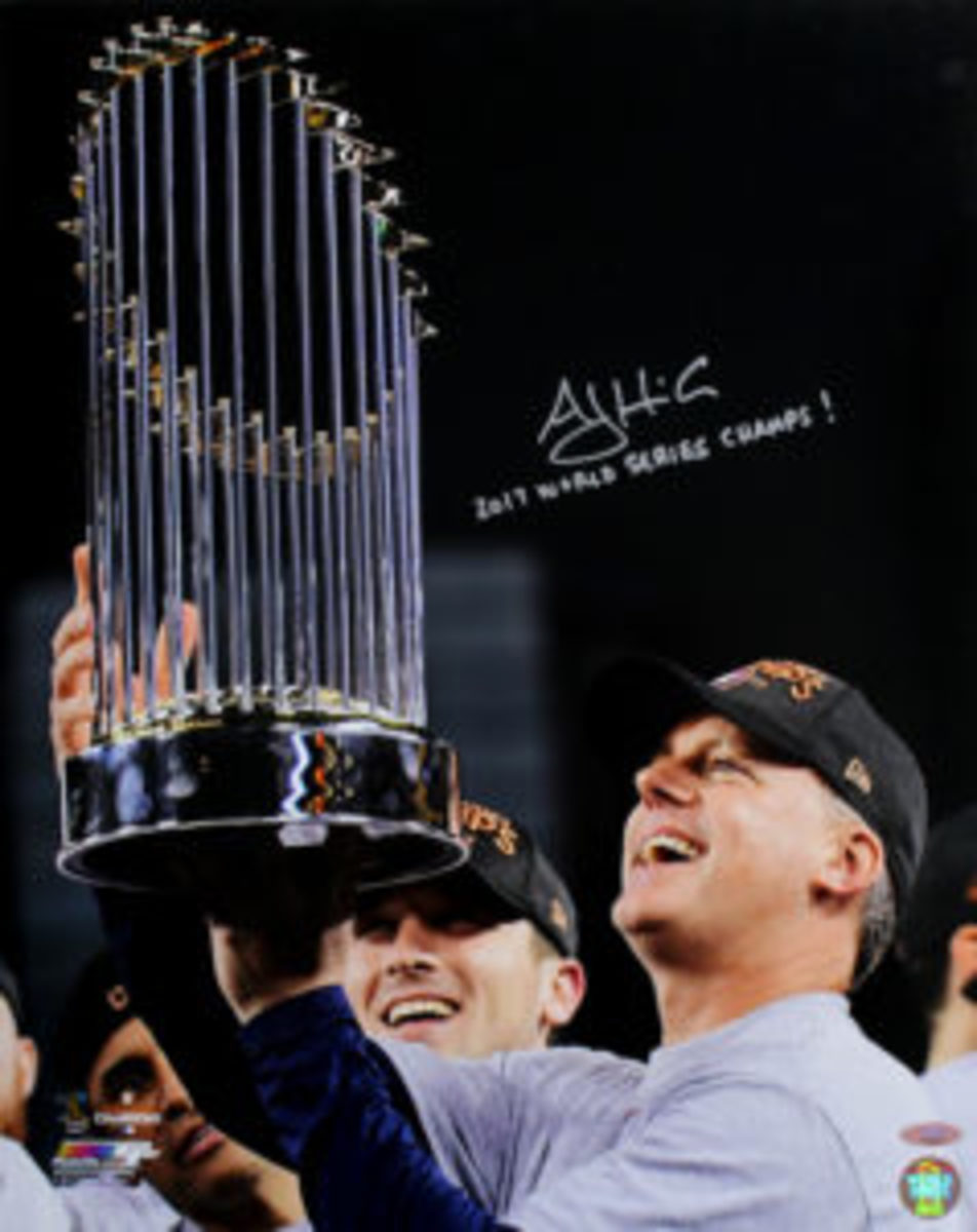  A.J. Hinch holds up the World Series trophy after the Houston Astros won the 2017 World Series.