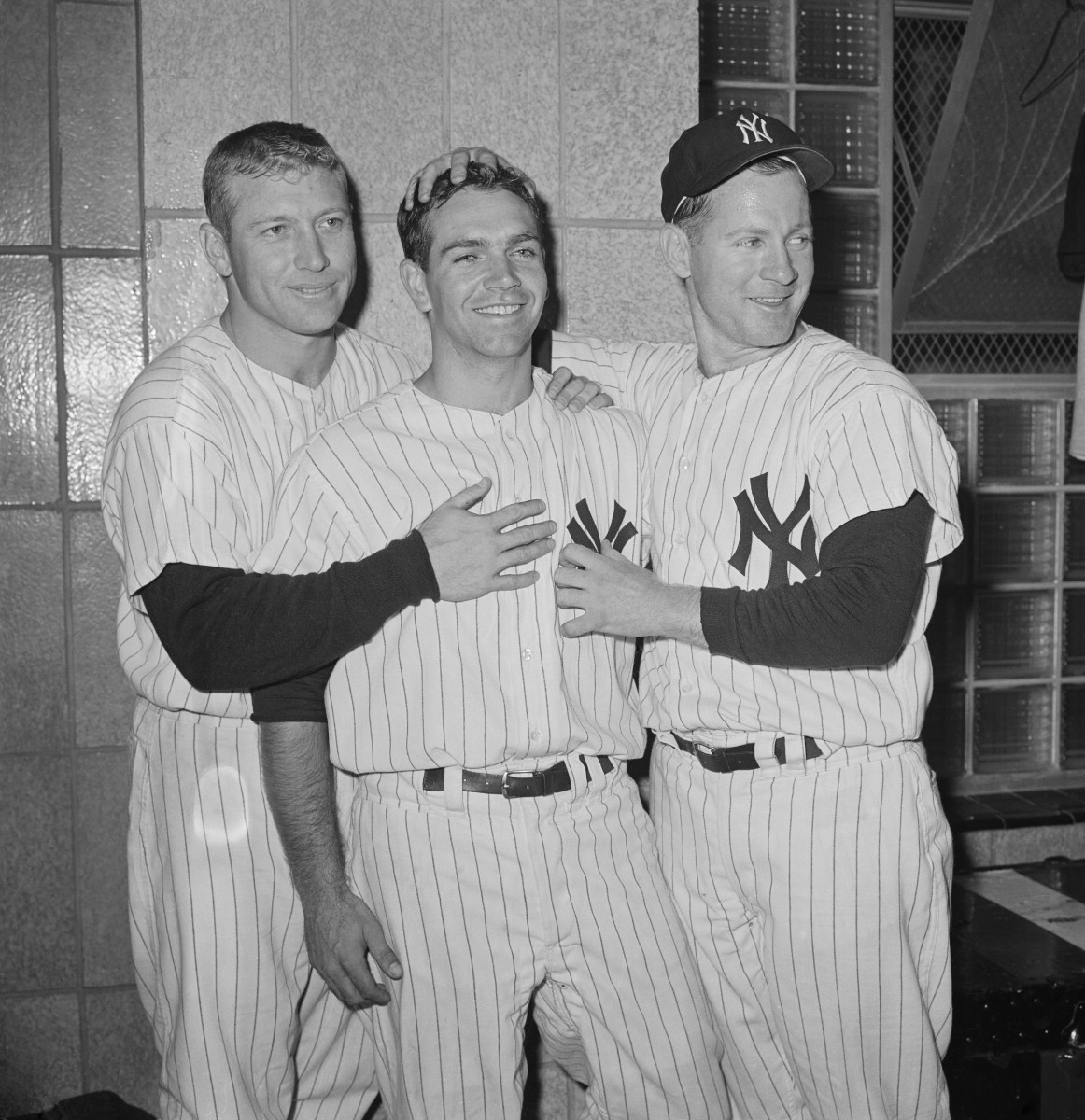 Mickey Mantle and Whitey Ford celebrate with Richardson after Game 3. Photo: Bettmann/Getty Images