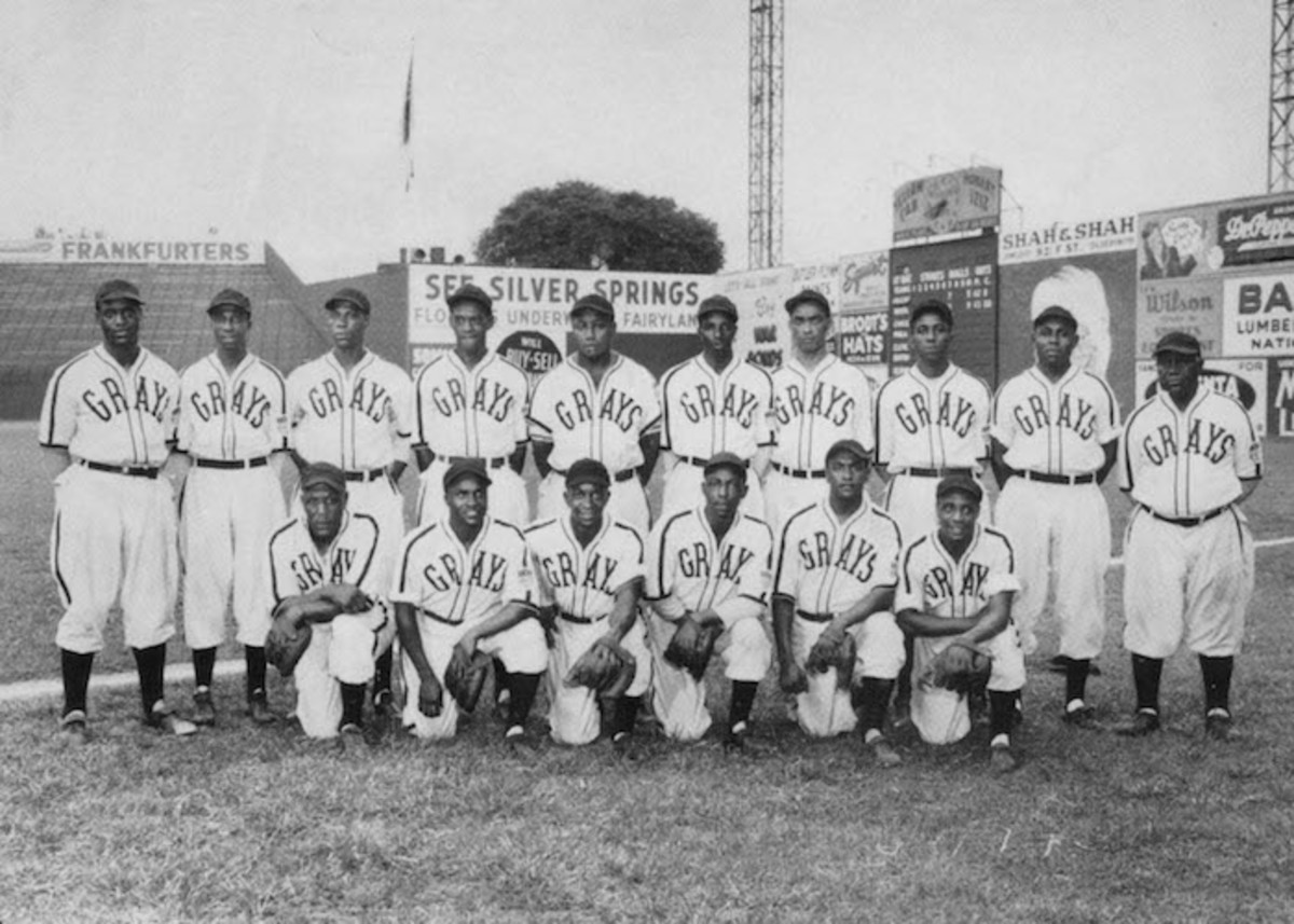 Image of BASEBALL: NEGRO LEAGUES. 'Cool Papa' Bell (front Row, Center), ' Satchel' Paige (middle, Far Right), Josh Gibson (back, Far Left) And Other  Members Of An American Negro Leagues All-Star Team Which