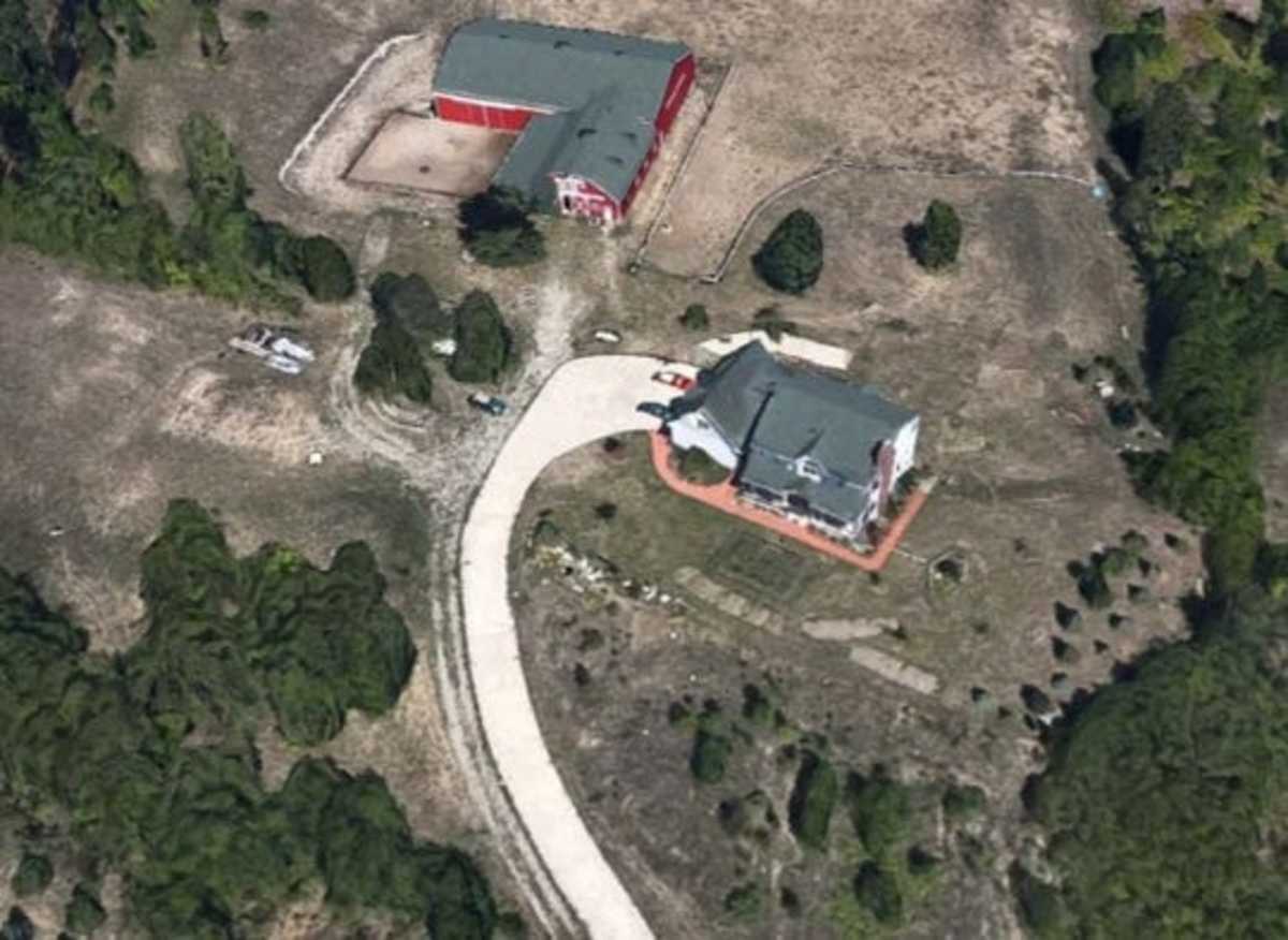 More than 30 FBI agents raided this house and barn last week as part of a years-long investigation into forged artwork and sports memorabilia.