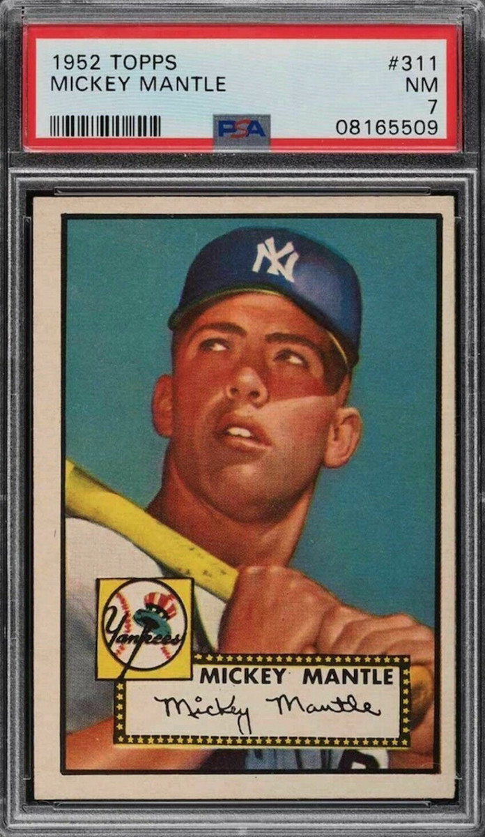 A PSA 7 1952 Mickey Mantle that sold for a bargain of $130,000 on eBay.