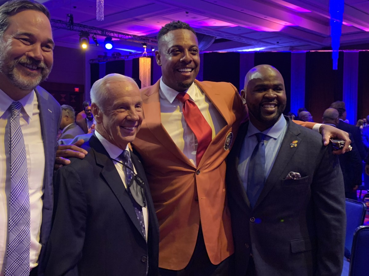 Paul Pierce (center) celebrates receiving his Hall of Fame jacket with Roy Williams, his college coach at Kansas.