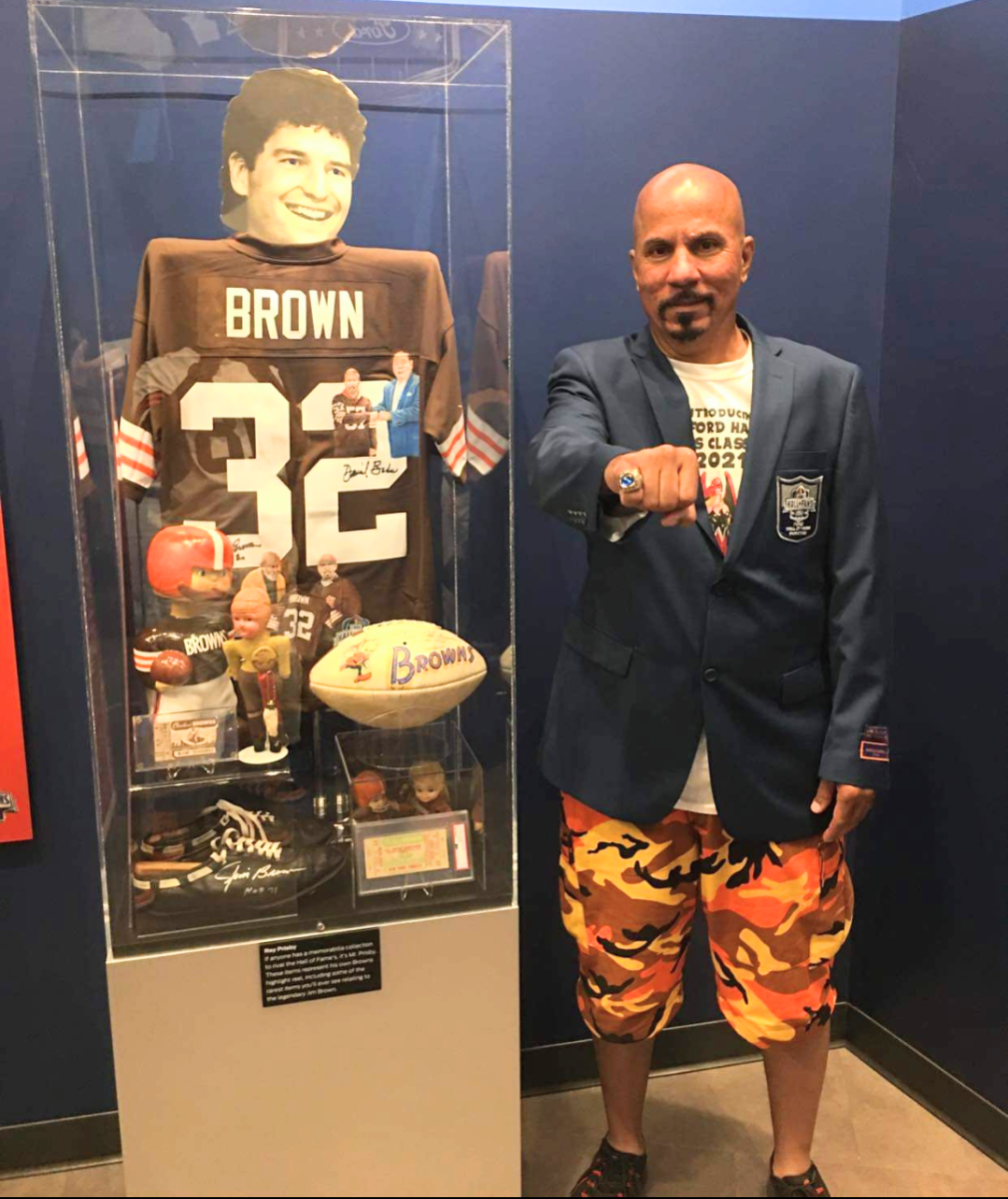 Collector Ray Prisby shows off his ring and display at the Pro Football Hall of Fame Hall of Fans.