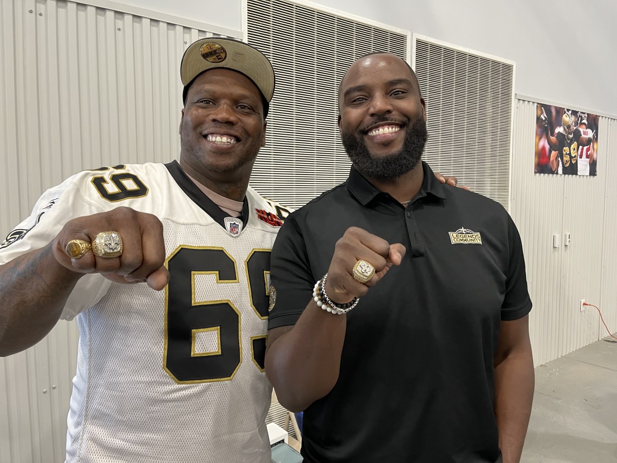 Former New Orleans Saints stars Anthony Hargrove and DeMario Pressley show off their Super Bowl rings.