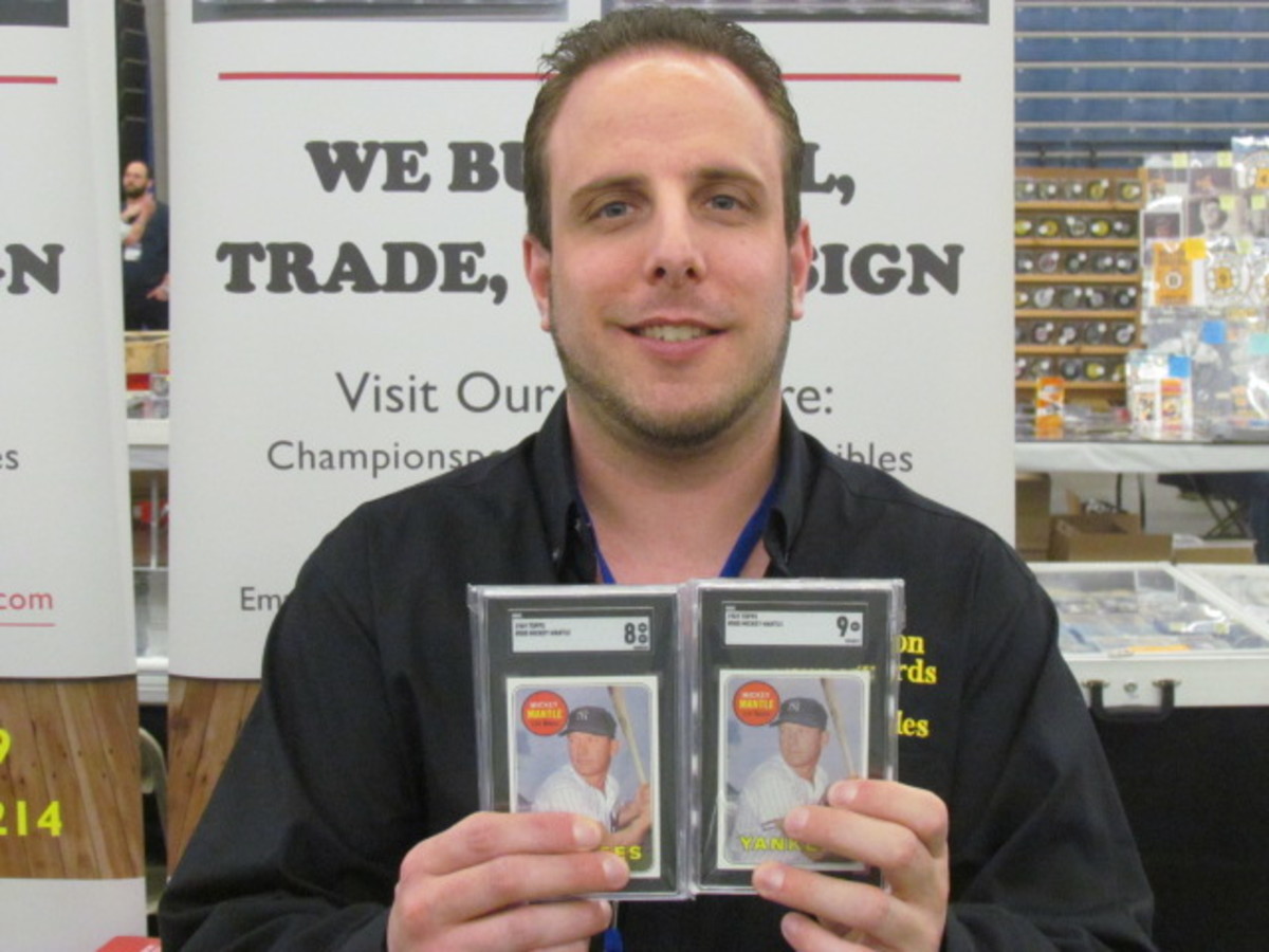 Dealer Jon Celona, co-owner of Champion Sportscards & Collectibles, shows off some Mickey Mantle cards at Rich Altman's Boston Show.