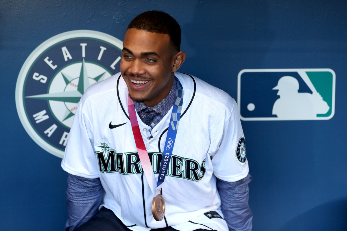 Seattle Mariners rookie Julio Rodriguez shows off his Dominican Republic bronze medal prior to a game in October 2021.