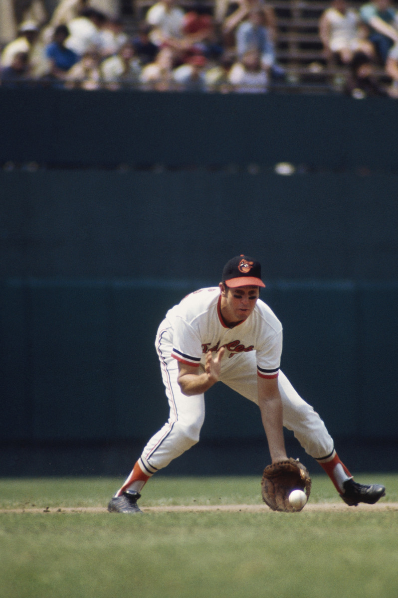 Brooks Robinson scoops up a ground ball against the Cincinnati Reds in the 1970 World Series in Baltimore.