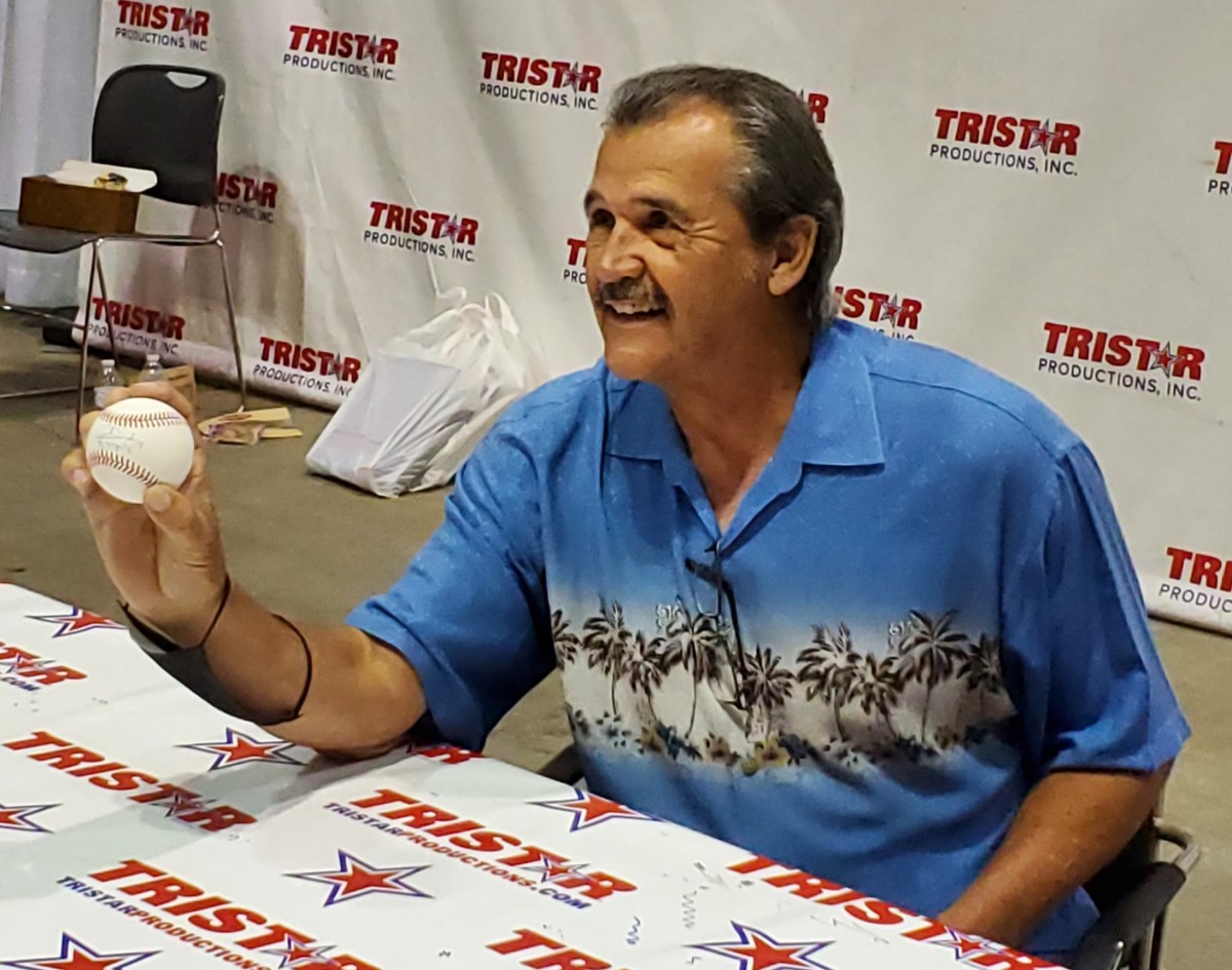 Former Yankees great Ron Guidry shows off an autographed baseball.