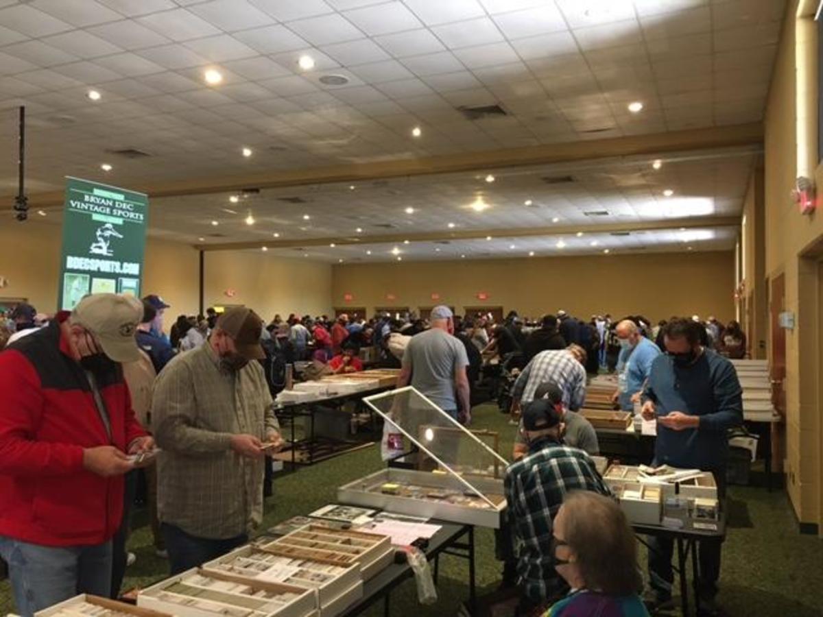 Collectors shop for sports cards at the Scottsboro Card Show in Scottsboro, Ala.