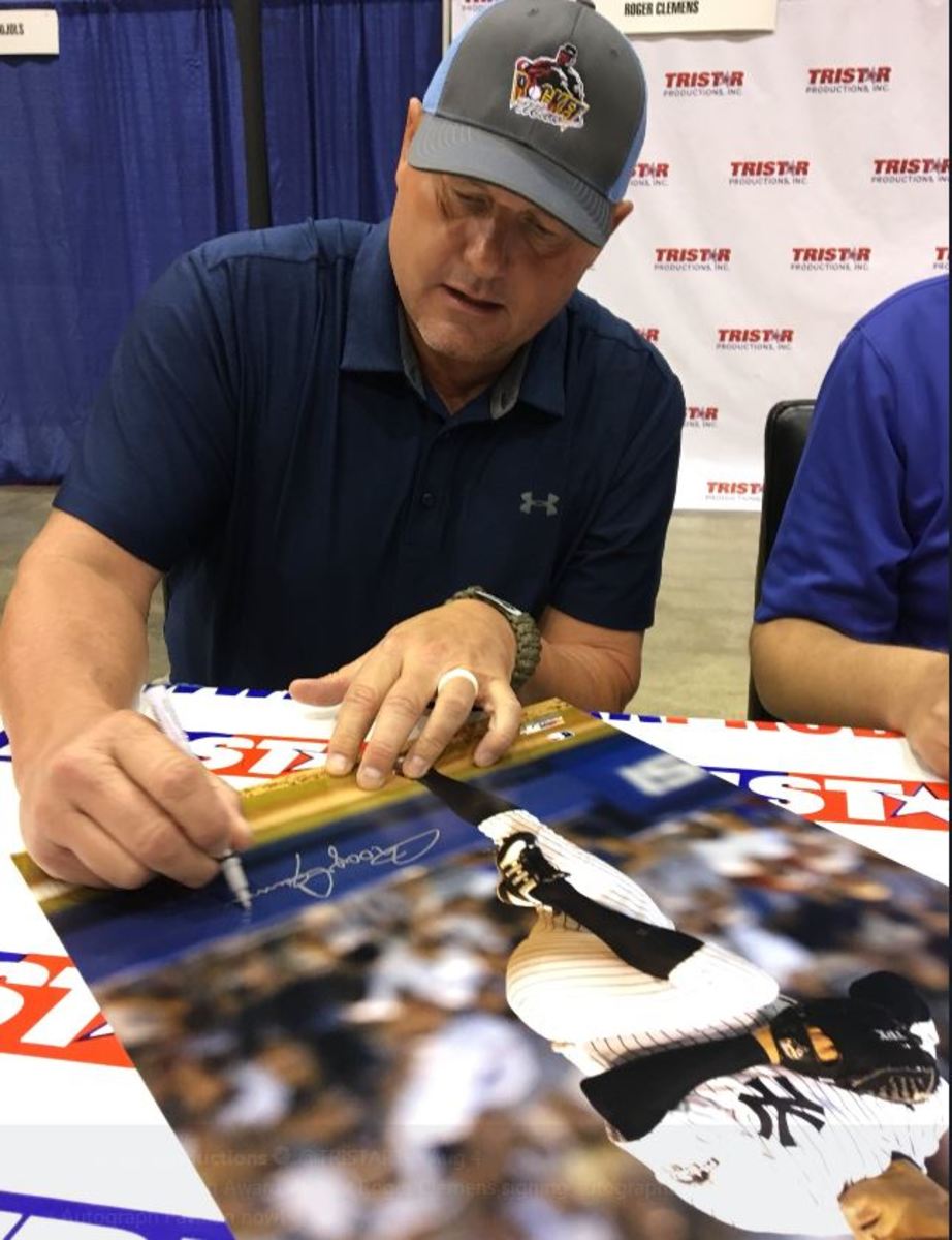 Roger Clemens signs autographs during the 2019 National.